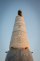 Low angle view of giant Our Lady of Loretto mosaic statue standing on Gaj hill over Primošten town under clear sky, Croatia © ventura
