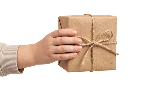 Toddler hand holding brown kraft paper wrapped gift box