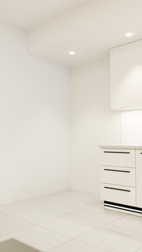 White modern kitchen corner with drawers and tile flooring