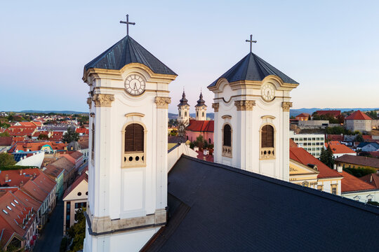 Minorite Church towers framed by Egri Bar&aacute;tok Temploma in eger