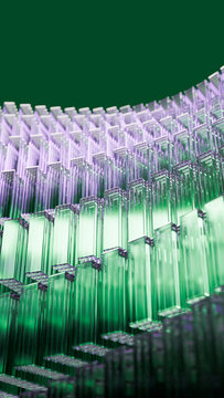 Stacked green and purple rectangular glass blocks in abstract pattern