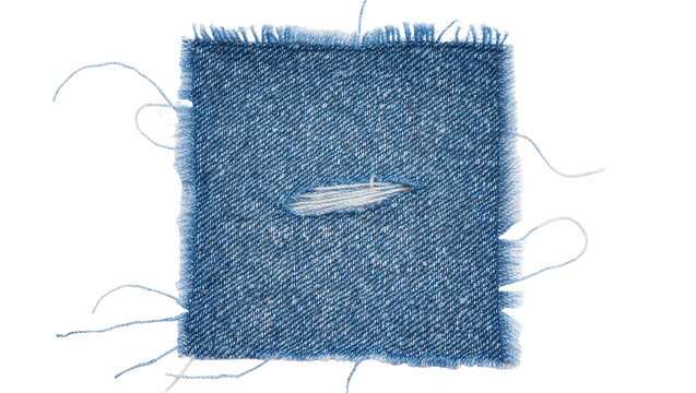 Square blue denim fabric swatch with frayed edges and a central rip, isolated on transparent background