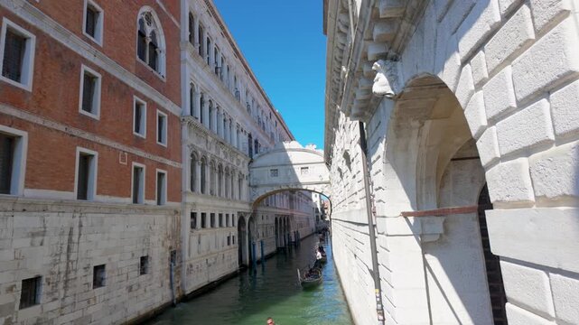 Venetian canal lined by historic palaces and stone arches