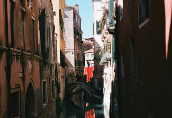analog film photo of traditional gondola boat in a channel in Venice in Italy, tourist landmark © davide bonaldo