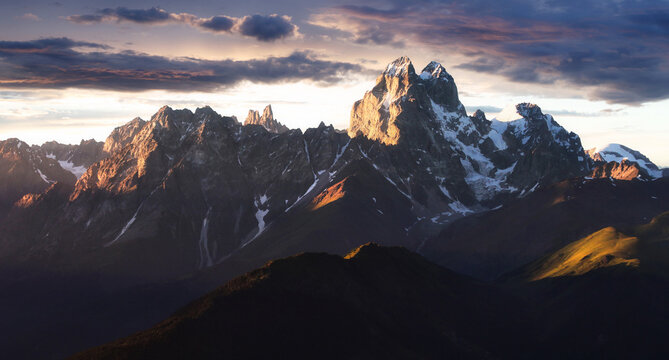 Ushba peak. Sunset panorama view of Caucasus mountains, Upper Svaneti, Georgia, Europe. Beauty of nature concept background