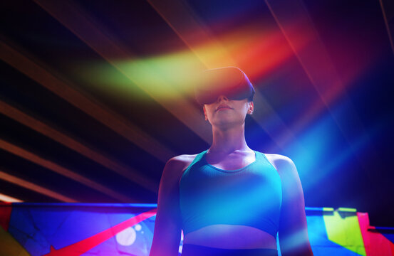 Woman wears a virtual reality headset in a colorful neon cyberspace