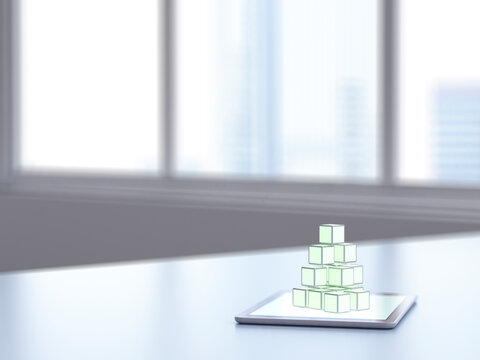 3D rendering, Pile of cubes on digital tablet on desk