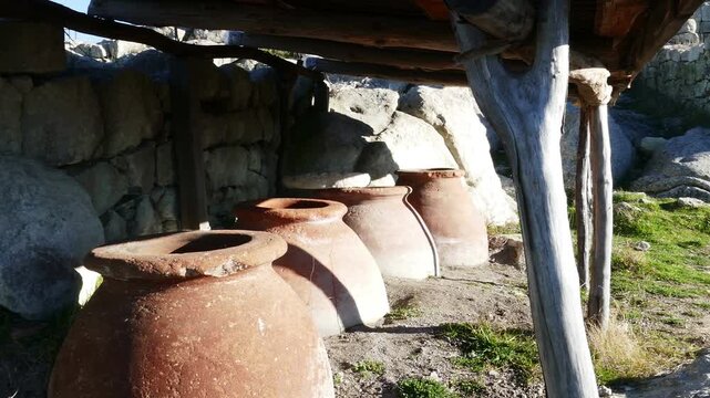 Ancient Thracian ceramics and several large clay pots used for grain storage. Archaeological artifacts located in the ancient sacred complex of Perperikon in Europe Bulgaria.
