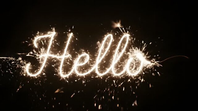 Greeting word Hello written with golden sparklers light painting on black background