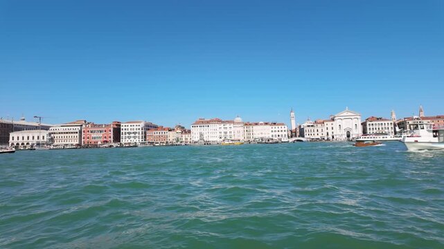 Venice passenger ferry crossing the lagoon past the historic