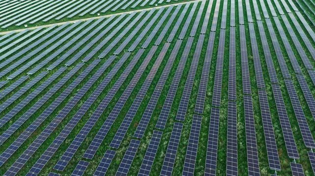 Parallel Panel Lines Converging Across Green Field