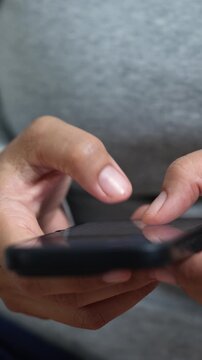 woman holds smart phone in her hands and scrolls through the news feed. Close up of hand uses mobile. point finger on screen, texting text message.