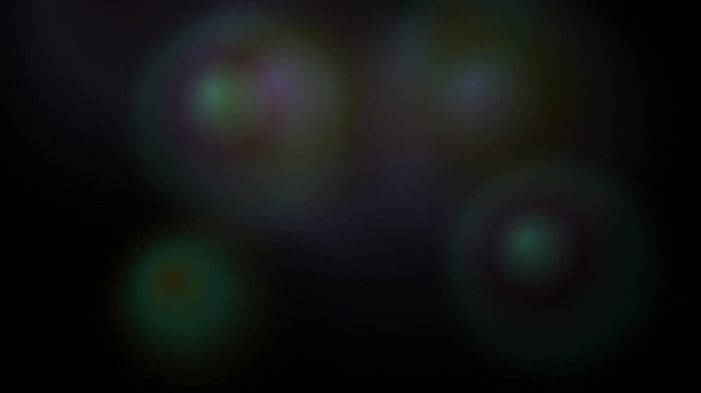 Soft circular bokeh lights glowing faintly in dark purple and green tones
