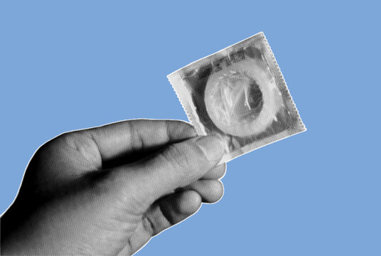 Close up of hand holding single pack of condom pixelate grayscale color halftone dotted texture style collage element isolated on blue background