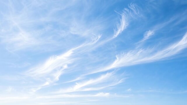 Wispy Cirrus Clouds in Azure Sky: Delicate, feathery cirrus clouds drift across a vast expanse of clear blue sky, painting a serene and ethereal masterpiece.
