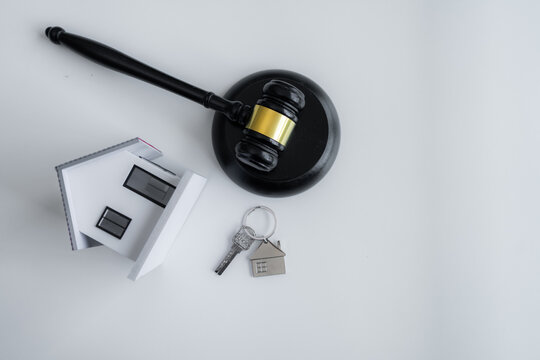 House model, home key and judge gavel represent property rights, real estate law, home ownership, legal protection, mortgage contracts, housing disputes and residential property services.