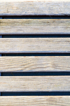 Texture background with weathered blue painted wooden planks and dark gaps between the horizontal boards across the surface