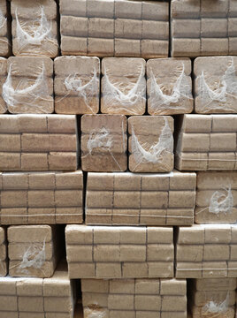 RUF wood fuel briquettes in film packaging. Stacks on a pallet,