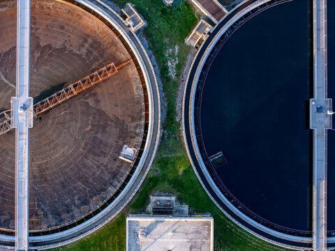 Aerial view of waste water treatment clarifier tanks with industrial infrastructure in Monroe, Michigan, United States.