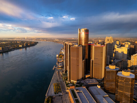 Aerial view of the Renaissance Center and the Detroit skyline along the Detroit River at sunset in Detroit, Michigan, United States.