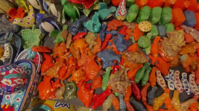 Close-Up of Artisanal Ceramic Fish, Birds, and Pottery Art at Handicraft Fair