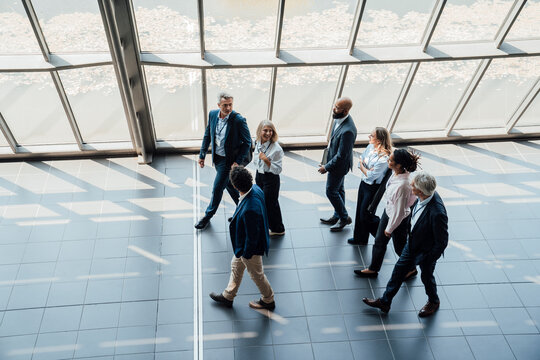 A business team walks through a modern conference hall