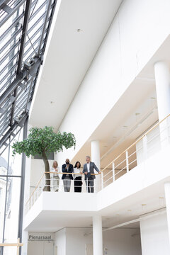 Business colleagues meet at a modern trade fair