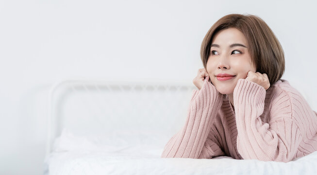 Portrait smile happy beautiful asian woman relax bedroom Asian girl face winter cloth Beauty short hair spa woman treatment perfect clear cosmetology skin Japanese girl makeup hygge lifestyle