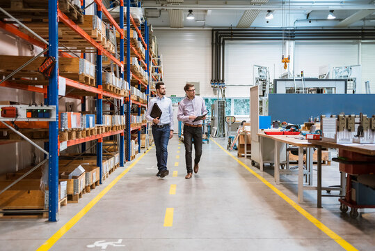 Engineers inspect a modern production hall