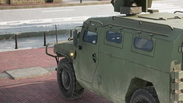 A military vehicle stands still on a pedestrian area in a city. Sunlight casts shadows on the brick pavement as trees line the backdrop, creating a serene yet commanding presence.