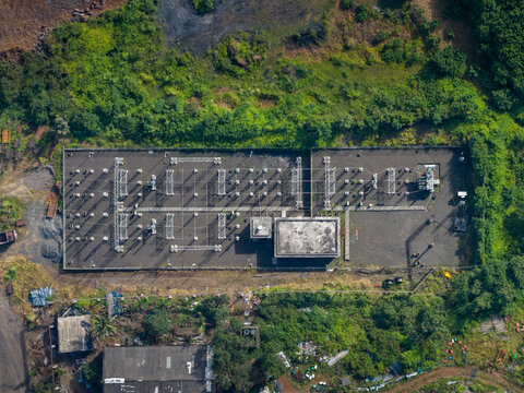 Aerial view of the Athani Sugars Limited Rayat Unit electrical substation with transformers and industrial equipment on a concrete pad in Shevalwadi, Maharashtra, India.