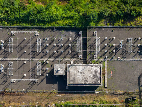 Aerial view of Athani Sugars Limited Rayat Unit featuring electrical substation infrastructure with metal structures and concrete buildings in Shevalwadi, Maharashtra, India.