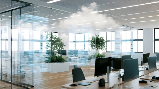 Modern office space with glass partitions  potted plants  and computer workstations under bright ceiling lights