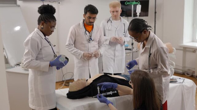 Medical students practicing clinical skills on a training mannequin