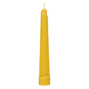 Yellow beeswax taper candle for festive table decor, isolated on transparent background