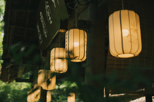 Traditional Chinese decorative lanterns on a wall of a house.