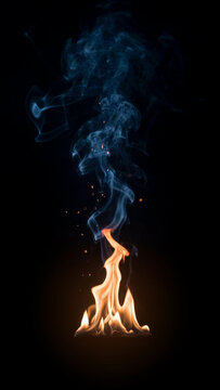 Small orange flames rising into blue smoke against dark background with campfire background vertical charcoal combustion wildfire intensity flammable incandescent pyrotechnics abstract