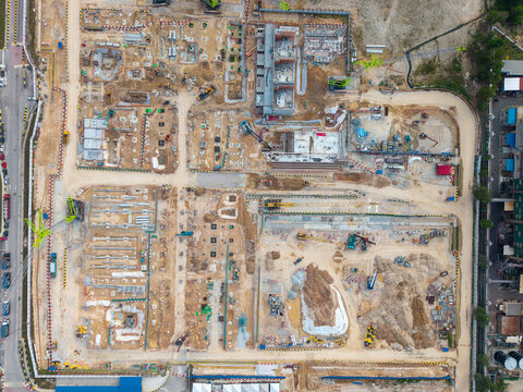 Aerial view of Silc Southern Industrial Logistics Clusters construction site with cranes, earthworks, and foundations in Gelang Patah, Johor Darul Ta'zim, Malaysia.