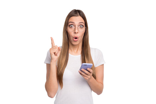 Photo of cheerful beautiful girl having just made up her mind and found decision while isolated with white background