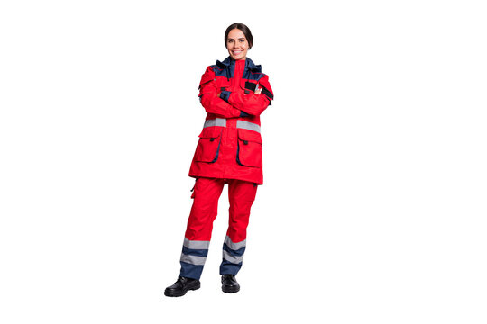 Full length photo of shiny positive young woman paramedic wear red jacket smiling arms crossed isolated white color background