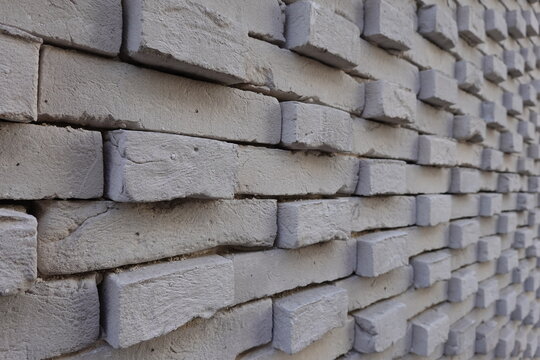 Mur de parement en briques grises avec calepinage 3D