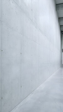 Concrete wall and floor in modern corridor