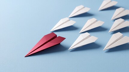Fototapeta premium Red Paper Plane Leading a Fleet of White Paper Airplanes on a Blue Background, Symbolizing Leadership, Success, Unique Business Strategy, Innovation, and Being the Top Choice in Industry