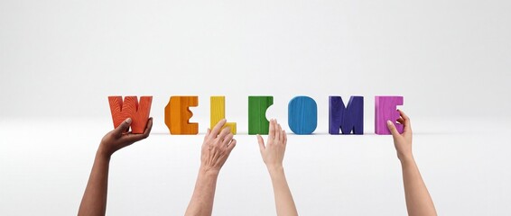 Fototapeta premium Diversity and Inclusion Concept with Multi-ethnic Hands Holding Colorful Wooden Blocks Spelling Welcome Against a Clean White Background for Business and Community Greeting Banners