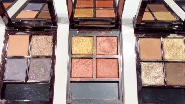 Eyeshadow and Blush Palettes on Display in Cosmetics Store &ndash; Colorful Makeup Products on Shelf