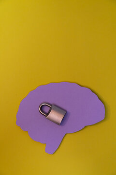 Silhouette of a human head with a padlock. Visual concept about mental health, privacy, psychology, or psychiatry