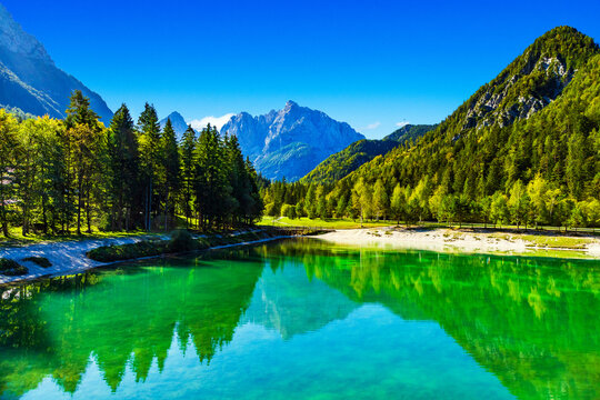Scenic Jasna lake in Kranjska Gora, Slovenia. Julian Alps in background.