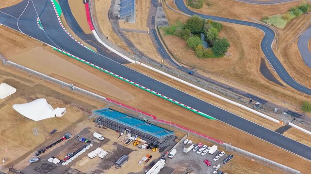 Racing Car Speeds Along the Asphalt Track at Silverstone Circuit