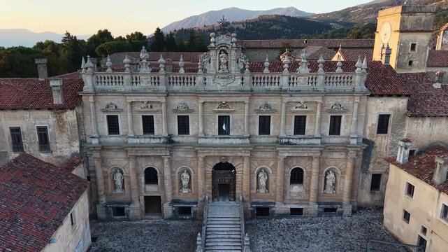 Baroque facade and monumental double staircase in the inner courtyard of the Certosa di San Lorenzo, Padula, Campania, Italy
