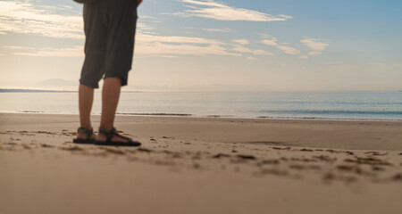 Senior man on active retirement standing on Cadiz beach at sunset © Paolo Corazza